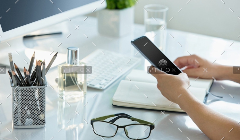 demo-attachment-1148-close-up-of-female-hands-using-smart-phone-while-PWQR3QP