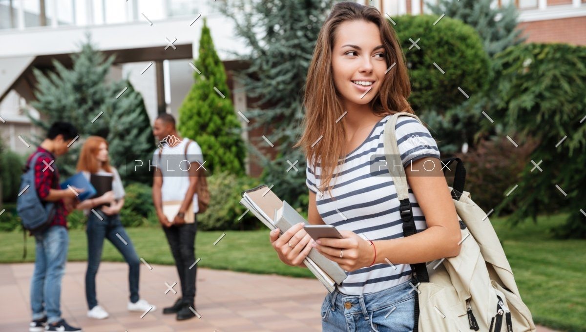 demo-attachment-1116-happy-woman-student-with-backpack-holding-books-PNFUGG71