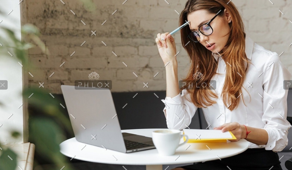 demo-attachment-1151-thoughtful-business-woman-indoors-using-laptop-P5HYUQX